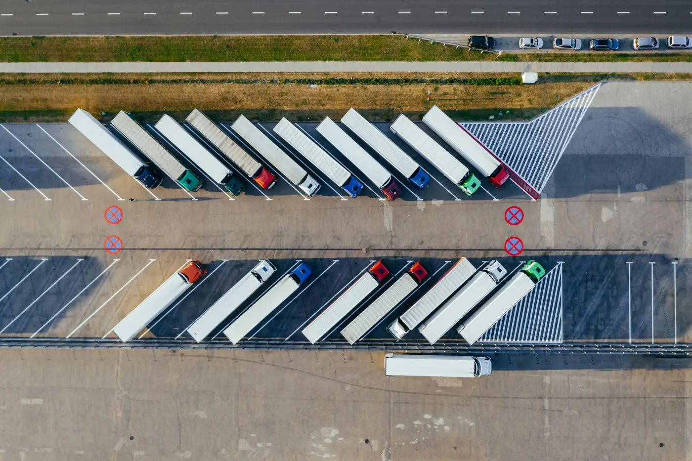 Aerial view of a yard with trucks from several carriers, marked on one map
